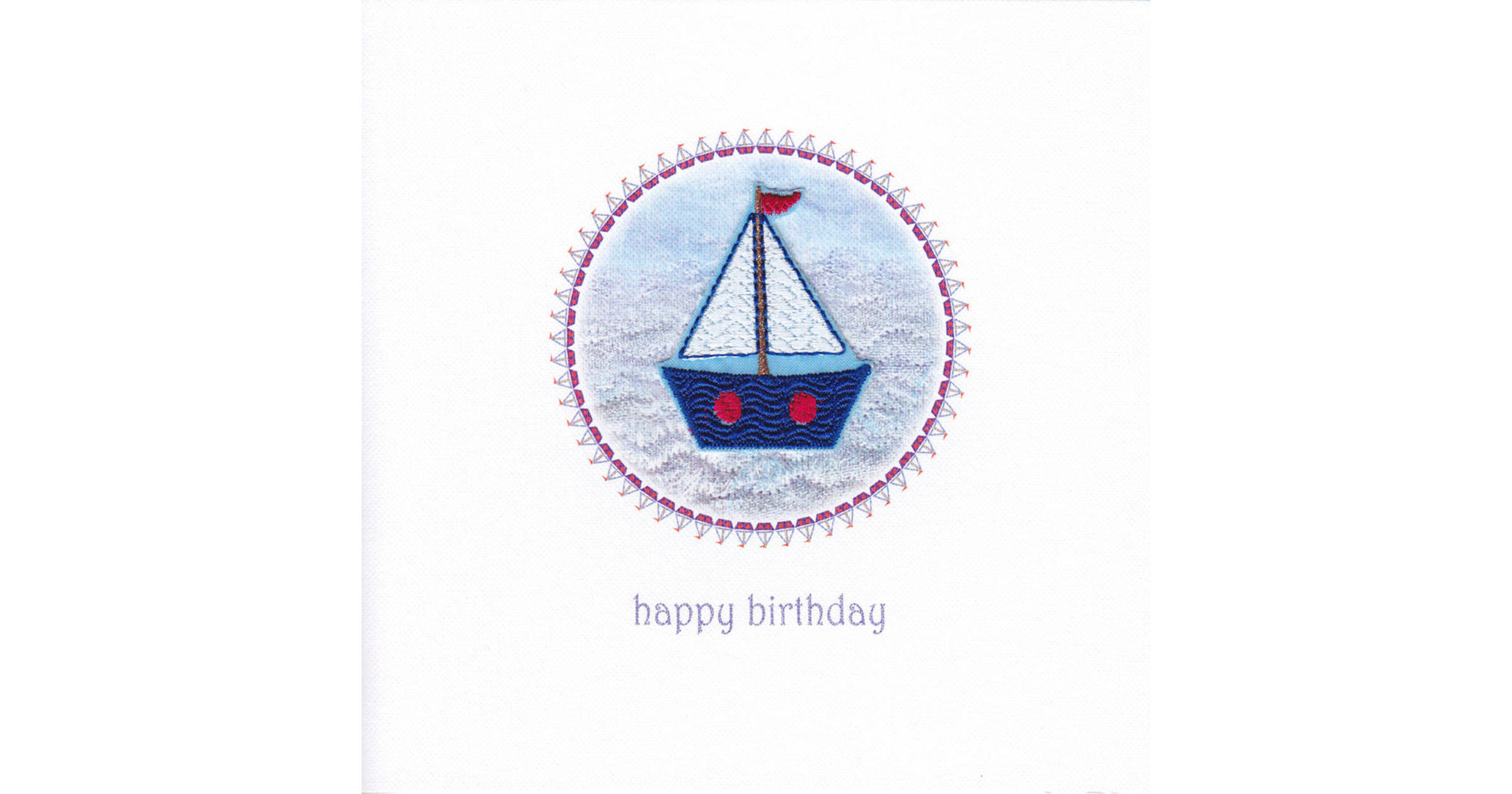 An embroidered yacht stitched with red blue and gold sparkly threads